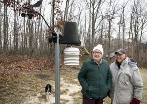 Kay Craigie, husband Carter, and dog Ditzy check their weather station just north of Blacksburg, VA.