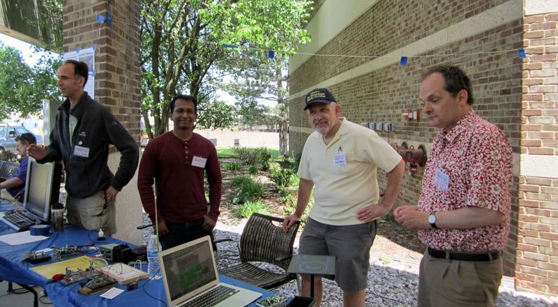 Most of the ham radio crew at the Ann Arbor Mini-Maker Faire yesterday. From left to right: Joe, AC8ES; Prem, AC8QV; yours truly; Ed KD8OQG.