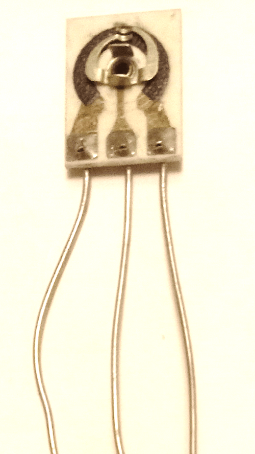 Photo of the innards of a potentiometer, showing the resistive element and slider.